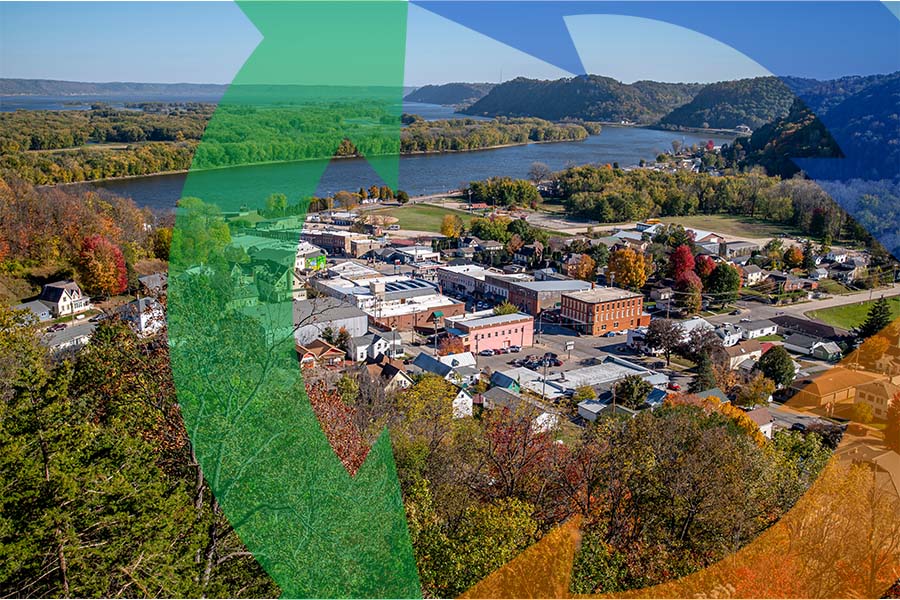 Small rural city near river from arial with Conexon logo around.