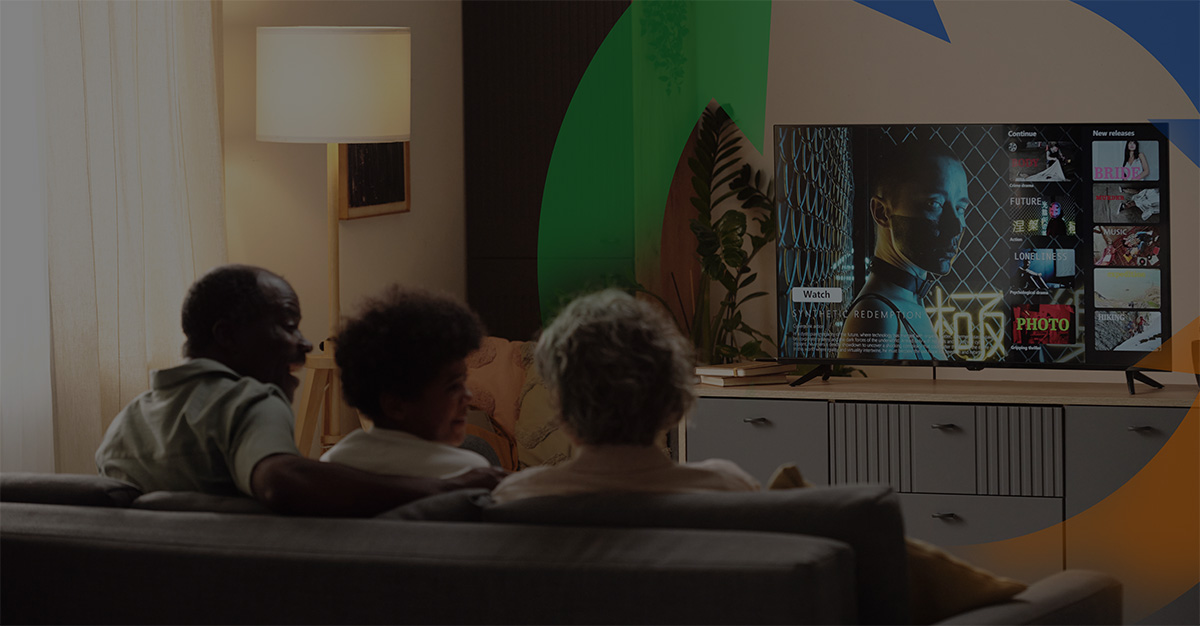 Family streams movie while sitting on couch.
